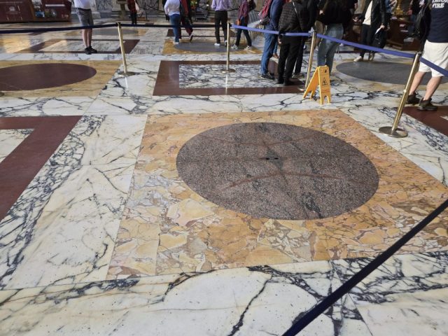 Underfoot, the floor showcases an elegant geometric pattern of colored marble, meticulously laid out in intricate designs. As you walk through the rotunda, the smoothness of the marble under your feet serves as a tactile reminder of the artistry that went into creating this architectural masterpiece.