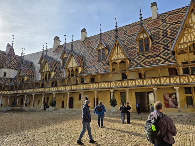 The hospital courtyard, displaying its unique glazed tile roof. The intent was to make the hospice patients feel at home and in a place of dignity.