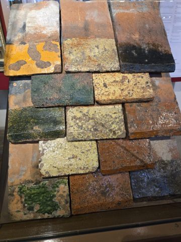 This is a closeup of the glazed ceiling tiles that still adorn the hospice roof.