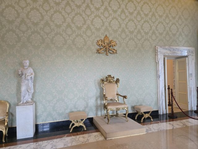 The papal-throne in the official 'meeting room' at Castel Gandolfo - with 2 seats for his closest advisors.